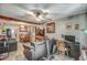 Spacious living room with ceiling fan, dining area, and hardwood floors at 2124 W Maricopa St, Phoenix, AZ 85009