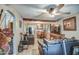 Open-concept living room with chandelier, ceiling fan, and hardwood floors at 2124 W Maricopa St, Phoenix, AZ 85009