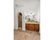 Bathroom with a walk-in shower, wooden cabinets, a tile countertop, and decorative mirror at 13055 W Eagle Talon Trl, Peoria, AZ 85383
