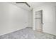 A bright bedroom with a standard closet, ceiling fan, and neutral paint throughout at 13055 W Eagle Talon Trl, Peoria, AZ 85383