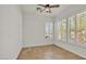 Bedroom featuring tile floors, bright light, and shuttered windows at 13055 W Eagle Talon Trl, Peoria, AZ 85383