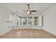 Bedroom with tiled flooring, plantation shutters, and large windows offering abundant natural light and views at 13055 W Eagle Talon Trl, Peoria, AZ 85383