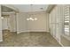 Bright dining area with tile floors and plantation shutters at 13055 W Eagle Talon Trl, Peoria, AZ 85383