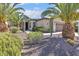 Beautiful single-story home featuring lush landscaping, mature trees, and a well-manicured yard at 13055 W Eagle Talon Trl, Peoria, AZ 85383