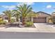 This home features lush desert landscaping and a two car garage at 13055 W Eagle Talon Trl, Peoria, AZ 85383