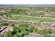 Scenic aerial view of the golf course and surrounding real estate at 13055 W Eagle Talon Trl, Peoria, AZ 85383