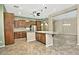 Spacious kitchen featuring granite countertops and dark wood cabinetry at 13055 W Eagle Talon Trl, Peoria, AZ 85383