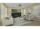 Bright living room featuring a neutral color palette, comfortable seating, and a built-in entertainment center at 13055 W Eagle Talon Trl, Peoria, AZ 85383