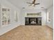 Bright living room featuring tile flooring, recessed lighting, and shuttered windows at 13055 W Eagle Talon Trl, Peoria, AZ 85383