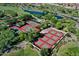 Aerial view of a sports complex with tennis and pickleball courts adjacent to the community golf course at 13055 W Eagle Talon Trl, Peoria, AZ 85383