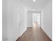 Bright hallway features wood-look tile flooring, recessed lighting, and neutral paint at 16766 W Yucatan Dr, Surprise, AZ 85388