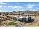 Aerial view of a contemporary home with a landscaped backyard and mountain backdrop at 31559 N Pamela Dr, Queen Creek, AZ 85144