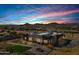 Aerial view showcases the home's design and desert setting at 31559 N Pamela Dr, Queen Creek, AZ 85144