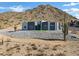 Modern house on hillside with mountain backdrop at 31559 N Pamela Dr, Queen Creek, AZ 85144