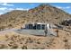 Aerial view of a house with mountain backdrop at 31559 N Pamela Dr, Queen Creek, AZ 85144