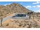 Aerial view of a house with mountain backdrop at 31559 N Pamela Dr, Queen Creek, AZ 85144