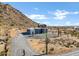 Aerial view of a house with mountain backdrop at 31559 N Pamela Dr, Queen Creek, AZ 85144