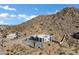 Aerial view of a house with mountain backdrop at 31559 N Pamela Dr, Queen Creek, AZ 85144