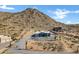 Aerial view of a house with mountain backdrop at 31559 N Pamela Dr, Queen Creek, AZ 85144