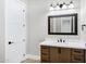 Modern bathroom with a vanity, mirror, and light fixtures at 31559 N Pamela Dr, Queen Creek, AZ 85144