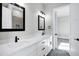 Double vanity bathroom with modern fixtures and mirrors at 31559 N Pamela Dr, Queen Creek, AZ 85144