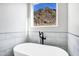 Bathroom features a freestanding tub and mountain views at 31559 N Pamela Dr, Queen Creek, AZ 85144