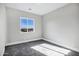 Bright bedroom with carpet flooring and a window at 31559 N Pamela Dr, Queen Creek, AZ 85144