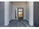 Modern entryway with wood door and tile flooring at 31559 N Pamela Dr, Queen Creek, AZ 85144