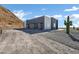 Modern home exterior with a two-car garage and a large saguaro cactus at 31559 N Pamela Dr, Queen Creek, AZ 85144