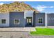 Modern home with gray and white exterior and mountain view at 31559 N Pamela Dr, Queen Creek, AZ 85144