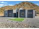 Modern home exterior boasts clean lines and a neutral color palette at 31559 N Pamela Dr, Queen Creek, AZ 85144