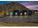 Contemporary home with desert landscaping and mountain backdrop at 31559 N Pamela Dr, Queen Creek, AZ 85144