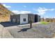 Modern home with gray exterior and mountain views at 31559 N Pamela Dr, Queen Creek, AZ 85144