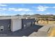 Contemporary home exterior with two-car garage and desert landscaping at 31559 N Pamela Dr, Queen Creek, AZ 85144