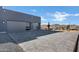 Two-car garage with gray doors and paved driveway at 31559 N Pamela Dr, Queen Creek, AZ 85144