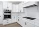 Modern kitchen with white cabinets, quartz countertops and island at 31559 N Pamela Dr, Queen Creek, AZ 85144