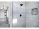 Modern shower with marble tile and glass enclosure at 31559 N Pamela Dr, Queen Creek, AZ 85144