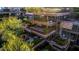 A high-angle view of the residential complex shows unique architecture and lush landscaping on each floor's patio at 7117 E Rancho Vista Dr # 4006, Scottsdale, AZ 85251