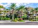 Stunning architecture featuring multi-story balconies with lush greenery and palm trees at 7117 E Rancho Vista Dr # 4006, Scottsdale, AZ 85251