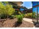 Beautiful community landscaping, lush green shrubs, and mature trees surround contemporary architecture with scenic outdoor walkways at 7117 E Rancho Vista Dr # 4006, Scottsdale, AZ 85251