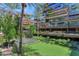 An elevated view of the putting green, water feature, and lush landscaping at 7117 E Rancho Vista Dr # 4006, Scottsdale, AZ 85251