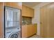 A conveniently located laundry room includes stainless steel units and ample cabinet space for storage at 7117 E Rancho Vista Dr # 4006, Scottsdale, AZ 85251