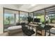 Bright office space with large windows overlooking the community's lush landscaping, perfect for work or relaxation at 7117 E Rancho Vista Dr # 4006, Scottsdale, AZ 85251