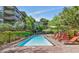 Outdoor pool area with lounge chairs and manicured landscaping at 7117 E Rancho Vista Dr # 4006, Scottsdale, AZ 85251
