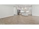 Open-concept living space with tile floors, modern kitchen, stainless appliances, and neutral paint for a modern appeal at 20306 W Turney Ave, Buckeye, AZ 85396