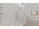 Modern bathroom featuring a glass shower with white subway tile and a sleek chrome shower head at 20306 W Turney Ave, Buckeye, AZ 85396