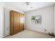 Bedroom with built-in wooden wardrobe at 4561 E Westchester Dr, Chandler, AZ 85249