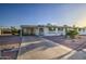 Charming home exterior with long driveway, desert landscaping, and welcoming front entrance at 10619 W Clair Dr, Sun City, AZ 85351