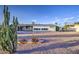 Beautiful home featuring desert landscaping, offering a unique Southwestern charm at 10619 W Clair Dr, Sun City, AZ 85351