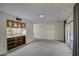 Open living space featuring neutral carpet and easy access to a bright sunroom at 10619 W Clair Dr, Sun City, AZ 85351
